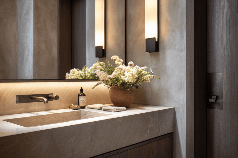 Mid-renovation primary bathroom in a NYC loft with construction documents and material samples organized on site