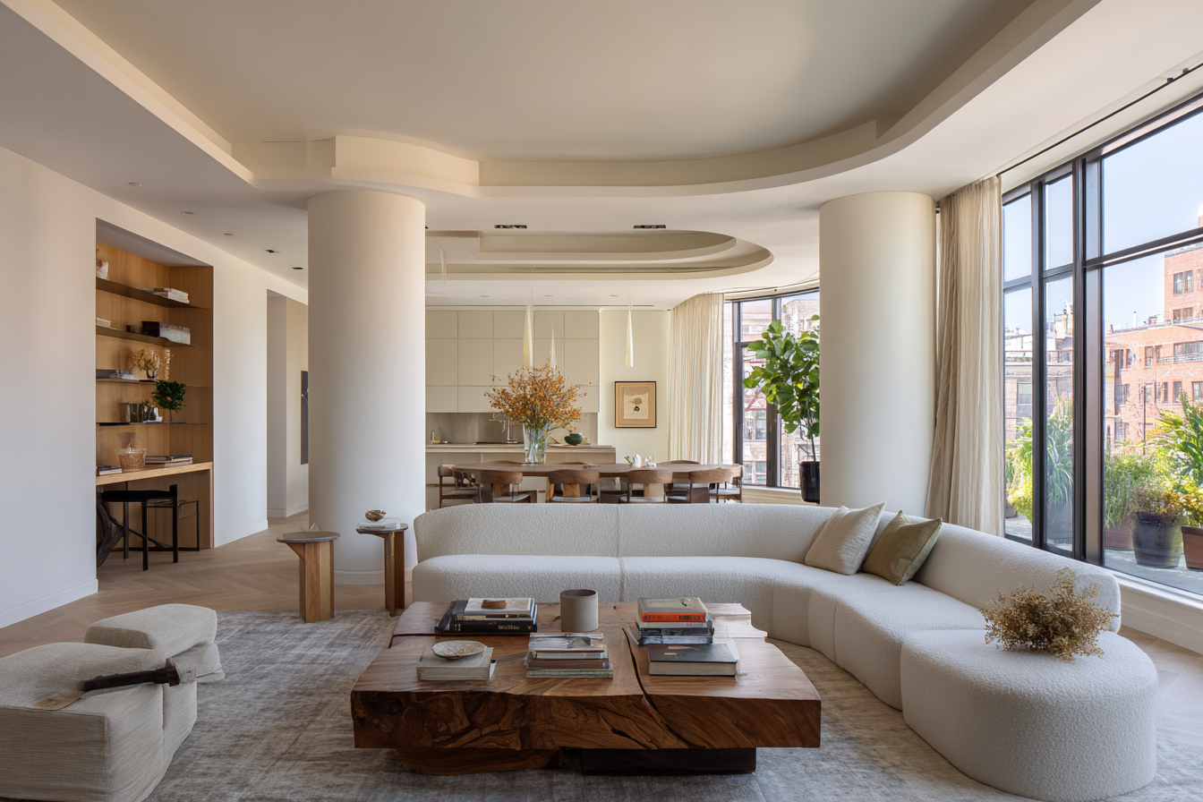 Luxury Manhattan living room mid-renovation with prewar molding and modern furnishings