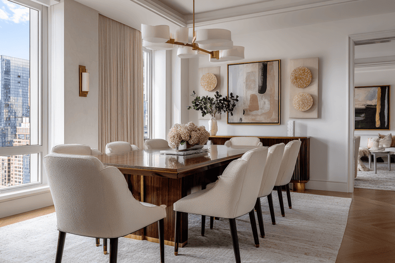 Landmark NYC townhouse dining room showcasing historic windows and modern high-end interior design