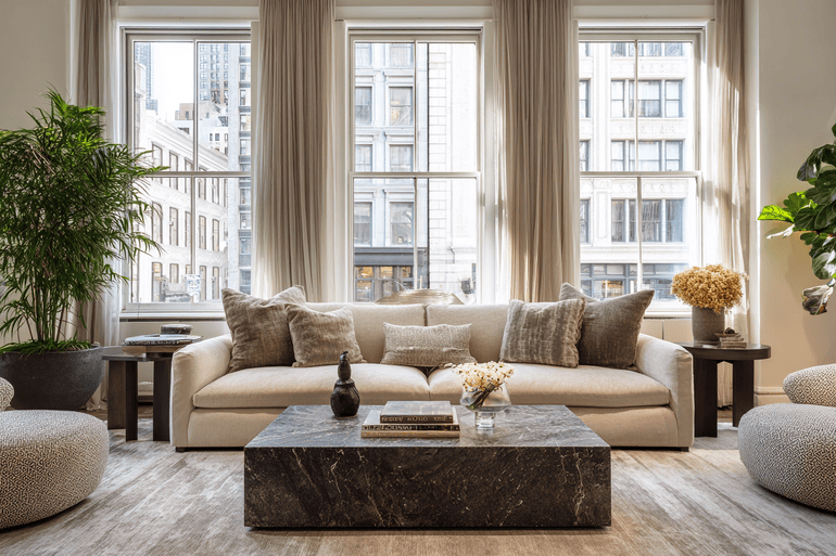 Luxury NYC loft living room with neutral tones and warm natural light